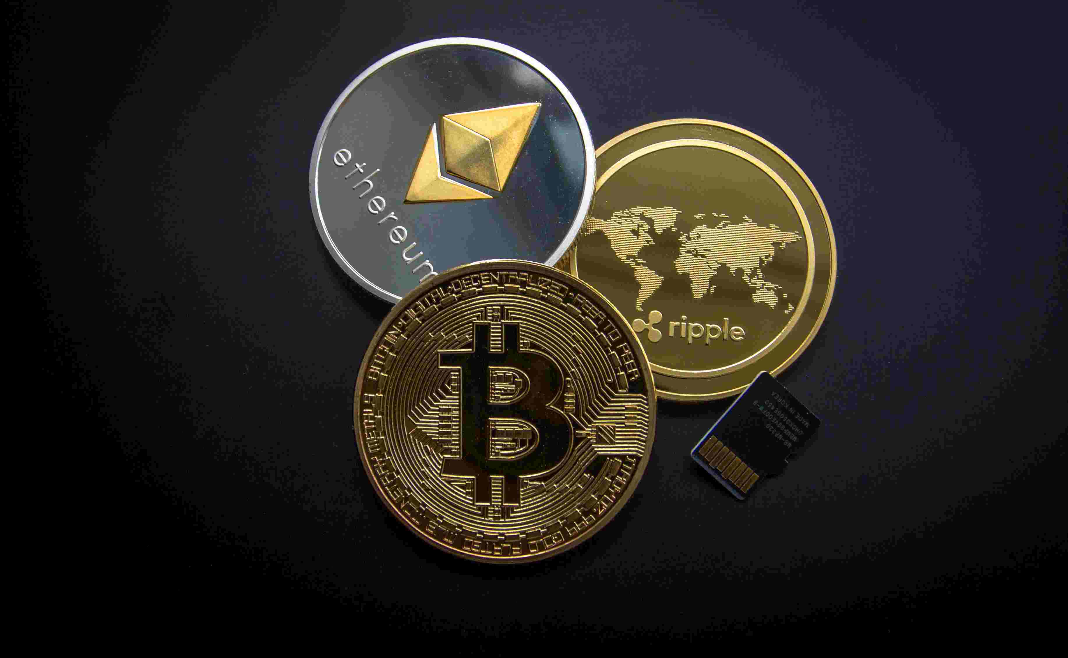 Image of 3 cryptocurrency coins